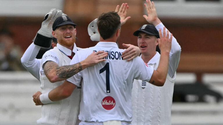 Robinson double-strike moves England closer between showers in First Test